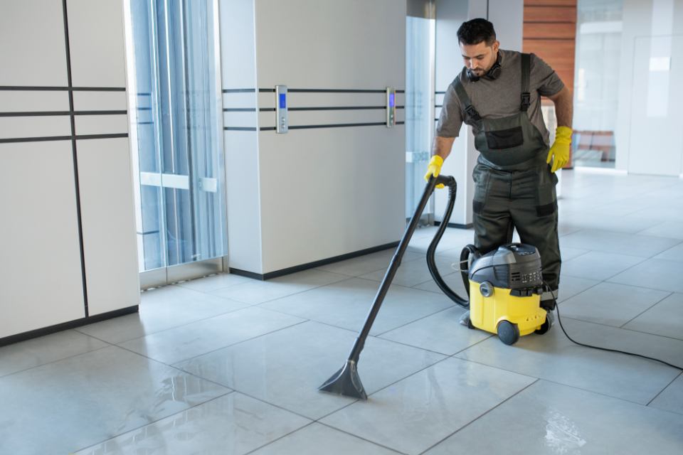 Man vacuuming the floor 